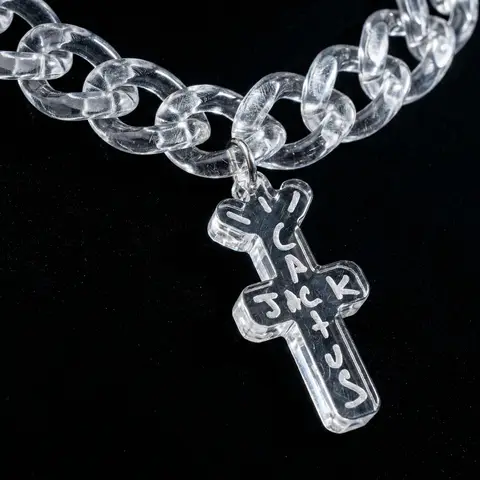 Transparent Acrylic Chain Logo Pendant Black Background Macro Shot